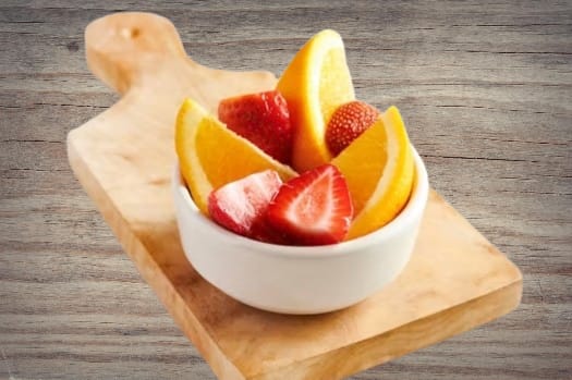 "Outback Steakhouse Kids Fresh Fruit cup with seasonal fruit slices, a healthy side option for children"