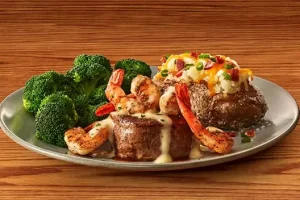 "Outback Steakhouse seafood menu featuring grilled salmon, lobster tails, coconut shrimp, and Toowoomba pasta in creamy sauce"

