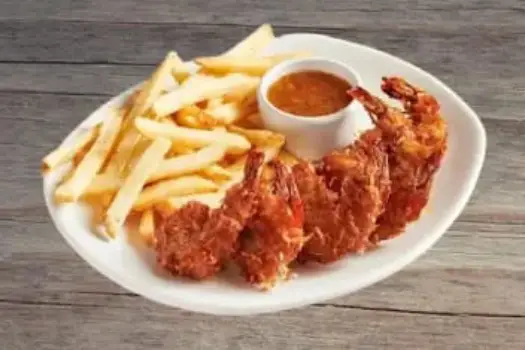 "Outback Steakhouse 6 Coconut Shrimp hand-dipped in coconut batter, fried golden and served with tangy marmalade sauce"