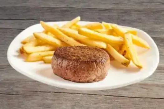 "Outback Steakhouse 6 oz Center-Cut Sirloin perfectly seasoned and seared, served with signature sides"