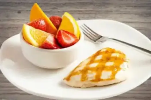 "Outback Steakhouse Grilled Chicken on the Barbie seasoned and flame-grilled, served with BBQ sauce and seasonal sides"

