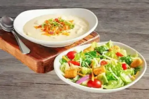 "Outback Steakhouse Soup and Salad Combo with fresh house salad and choice of hot soup, perfect for a light lunch option"