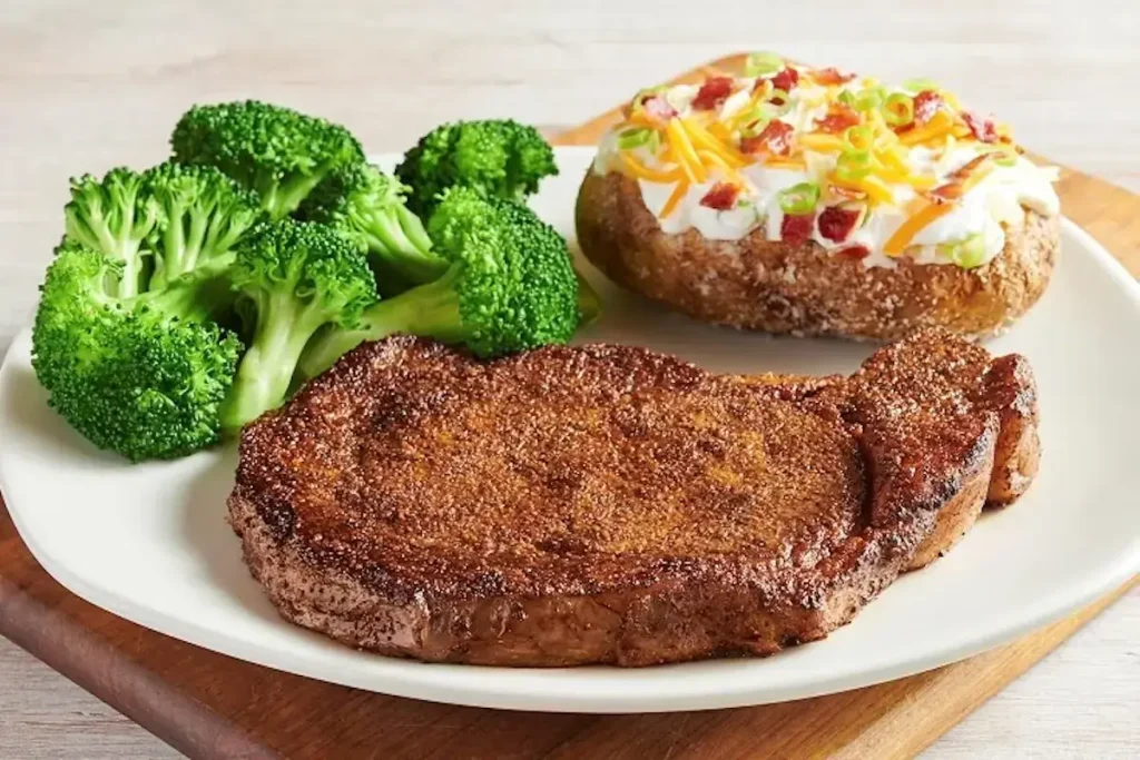 13 oz Ribeye steak – well-marbled, juicy, and boldly seasoned ribeye grilled to perfection – premium Outback Steakhouse cut