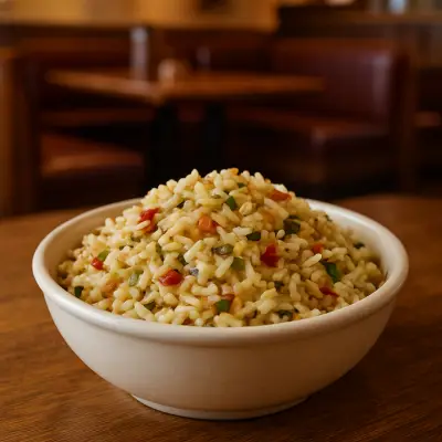 Seasoned Rice – fluffy white rice cooked with savory herbs and spices, served as a flavorful Outback Steakhouse side dish