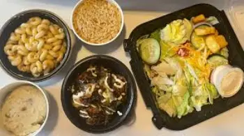 "Outback Steakhouse 2025 sides menu featuring updated favorites like seasoned rice, Aussie fries, loaded mashed potatoes, and new seasonal veggies"

